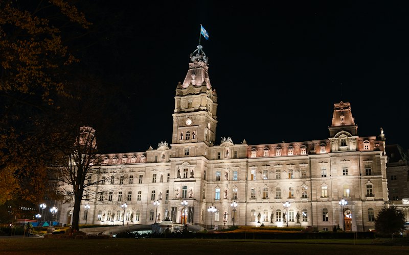 Government building at night, representing regulatory and licensing advisory